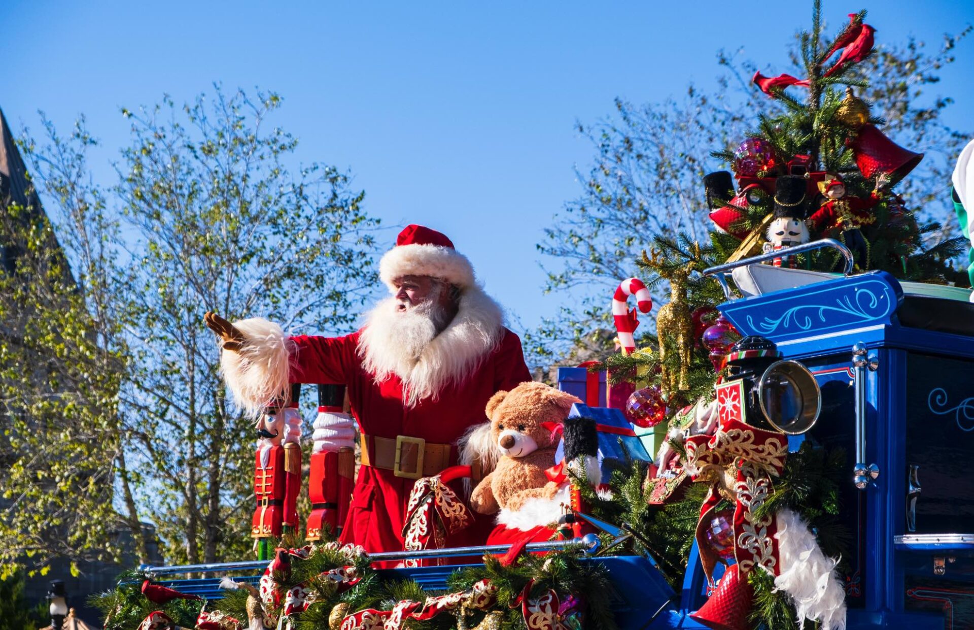 This image depicts a Santa Clause waiving at Parade goers to represent the family centric event being hosted this year on December 1st in Seal Beach